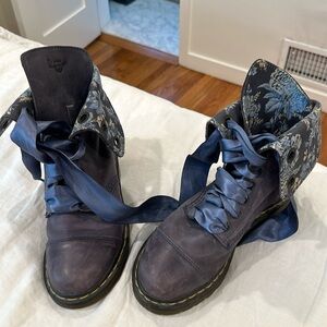 Doc Marten combat boot with floral detail and ribbon laces